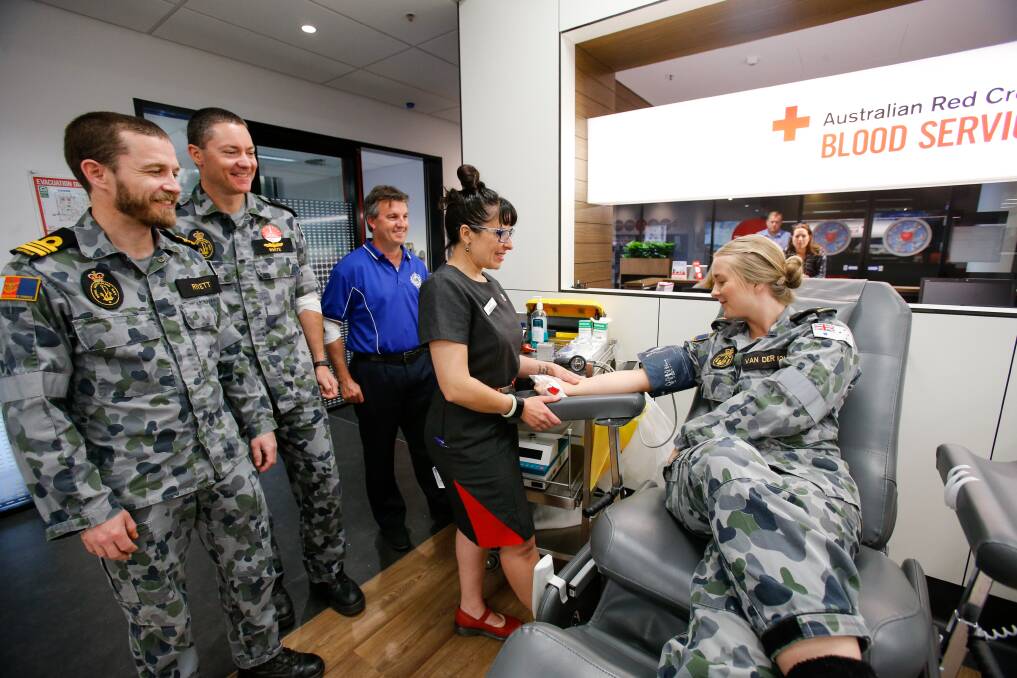 DONATIONS: Wollongong Red Cross blood bank nurse Rebecca Furniss with Navy personnel LCDR Scott Rivett, CPO Ben White, Paul Green and AB Jess Van Der Kolk who were giving blood today as part of the Red Cross' October blood drive. Picture: Adam McLean. 