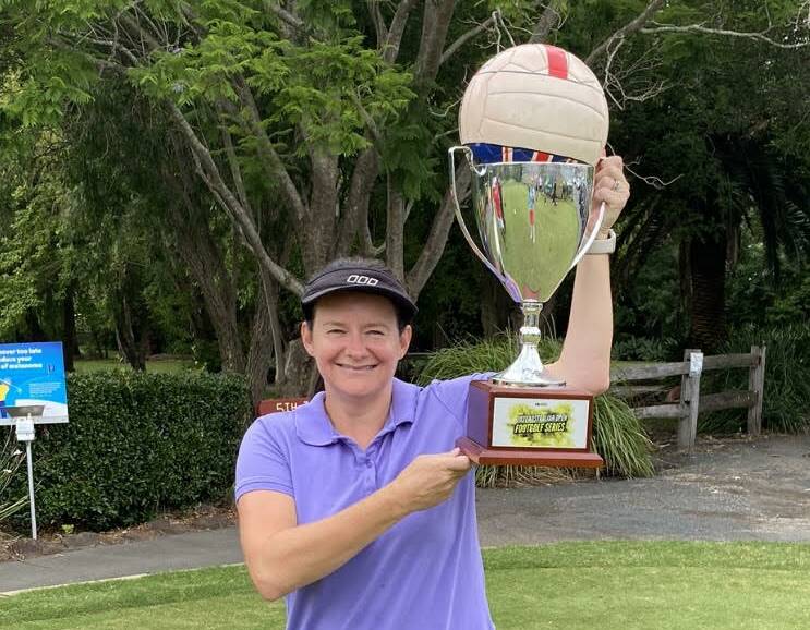 Katy Smith holds the trophy she was awarded as the lone female entrant in a footgolf competition at Jamberoo last year. Picture: supplied