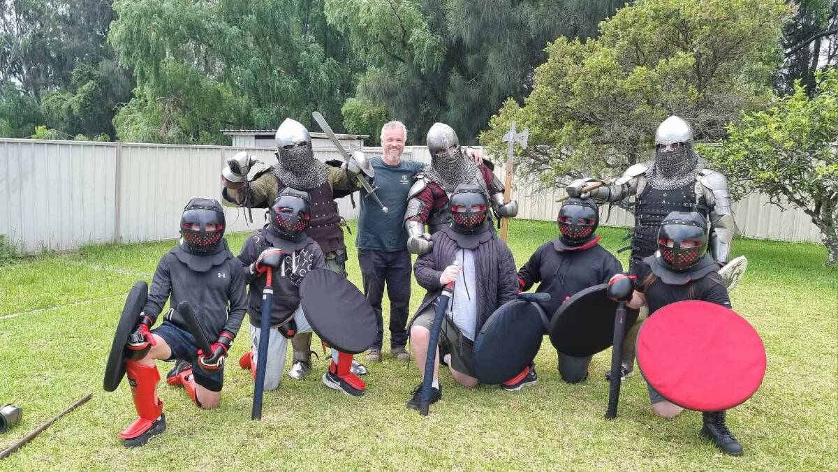 The Knights of Albion come together after a practice session in an Oak Flats backyard. Picture: supplied 