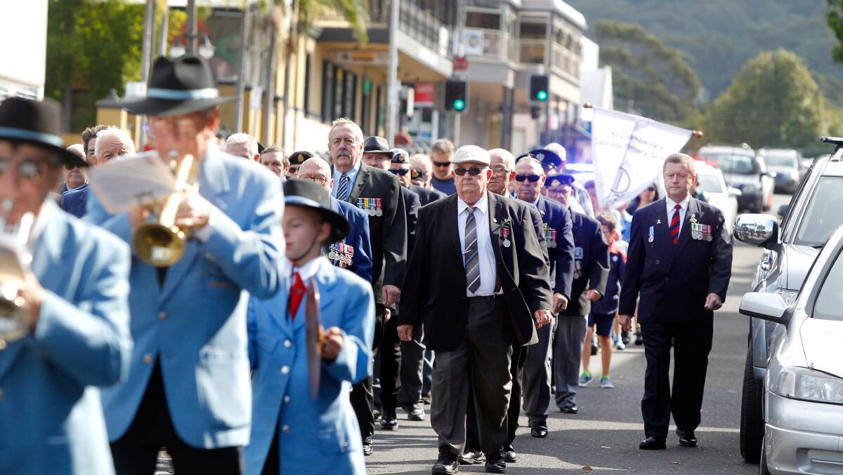 Where they belong: Corrimal's Anzac March last year, right down the middle of the main street. Picture: Sylvia Liber