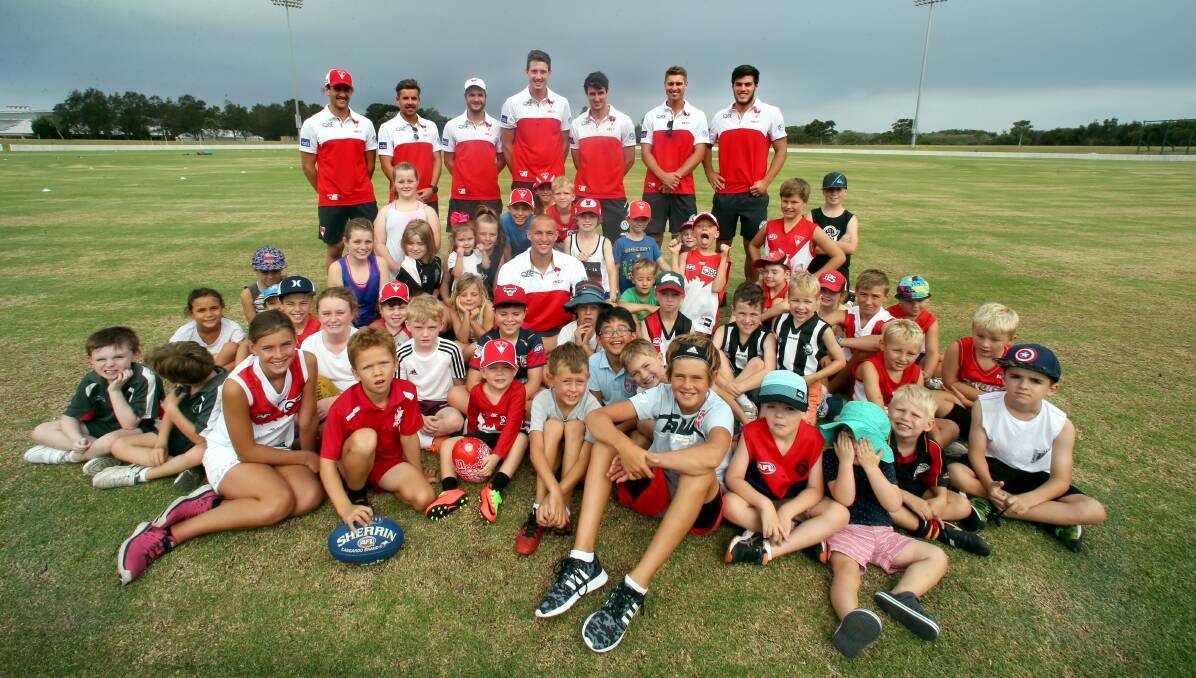 Swans time: Eight Sydney Swans including Sam Reid (centre) joined youngsters for a special AFL clinic at North Dalton Park. Picture: Sylvia Liber 