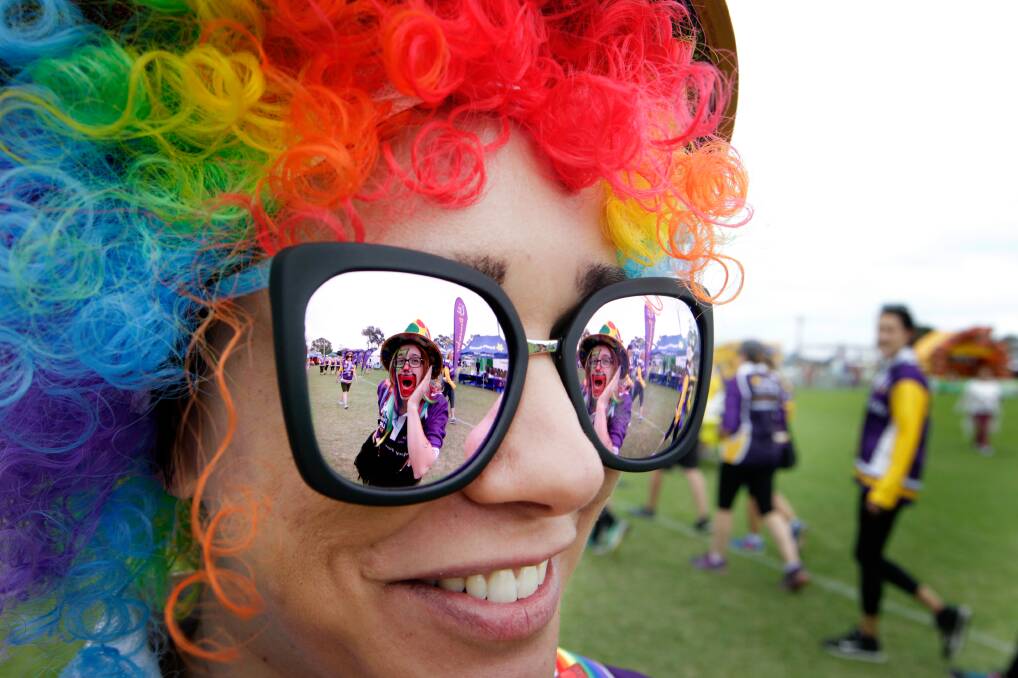 Run girl, run: Joanne Gomes (reflection) hams it up with Sheree Dean at the 2017 Cancer Council Shellharbour Relay for Life. Picture: Sylvia Liber