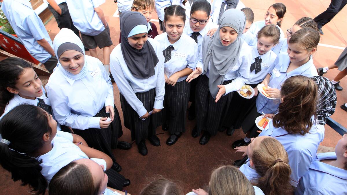 IN HARMONY: Harmony Day celebrations at Amity College Illawarra on Thursday also featured students from Holy Spirit College. Picture: Sylvia Liber