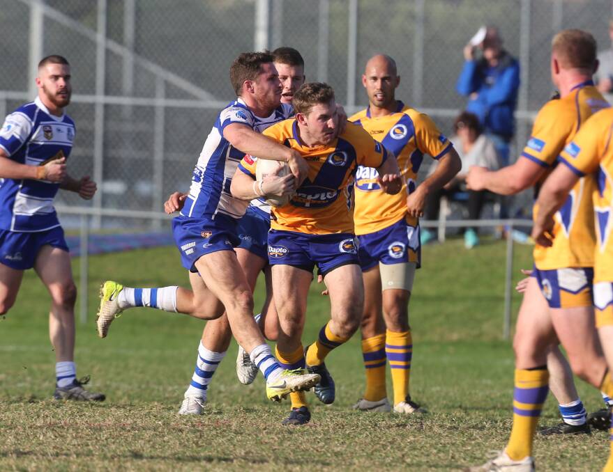 Caught: Dapto's Joshua Bryant is tackled during the Illawarra game against Thirroul. Picture: Robert Peet