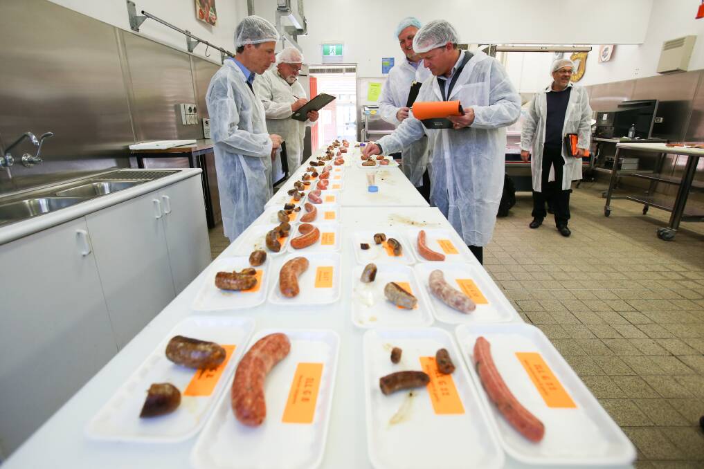 Judges at West Wollongong TAFE inspecting sausages from independent butchers from Illawarra and Southern Highlands who are battling it out for the best sausage and burger title. Picture: Adam McLean