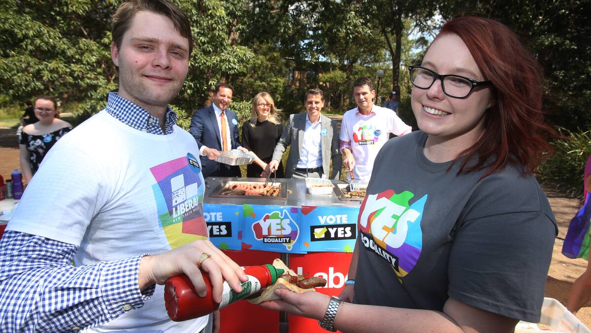RAINBOW BARBECUE: UOW Liberal Club president Cameron McLeod and UOW Labor Club president Caitlin Roodenrys were joined by Paul Scully, Kayla Steele, Ryan Park and Shayne Mallard. Picture: Robert Peet