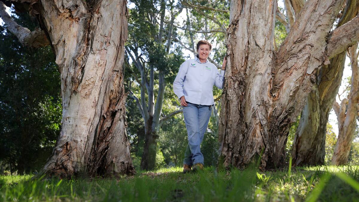 Penny Hoswell standing among the trees of Wollongong Botanic Garden. Picture by Sylvia Liber