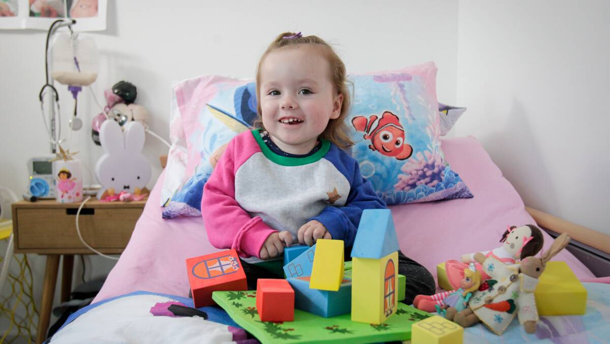 Tower of strength: The treatment has given Ruby a stronger grasp, allowing her to play with her toys better, and has helped her sit independently for the first time. Picture: Adam McLean