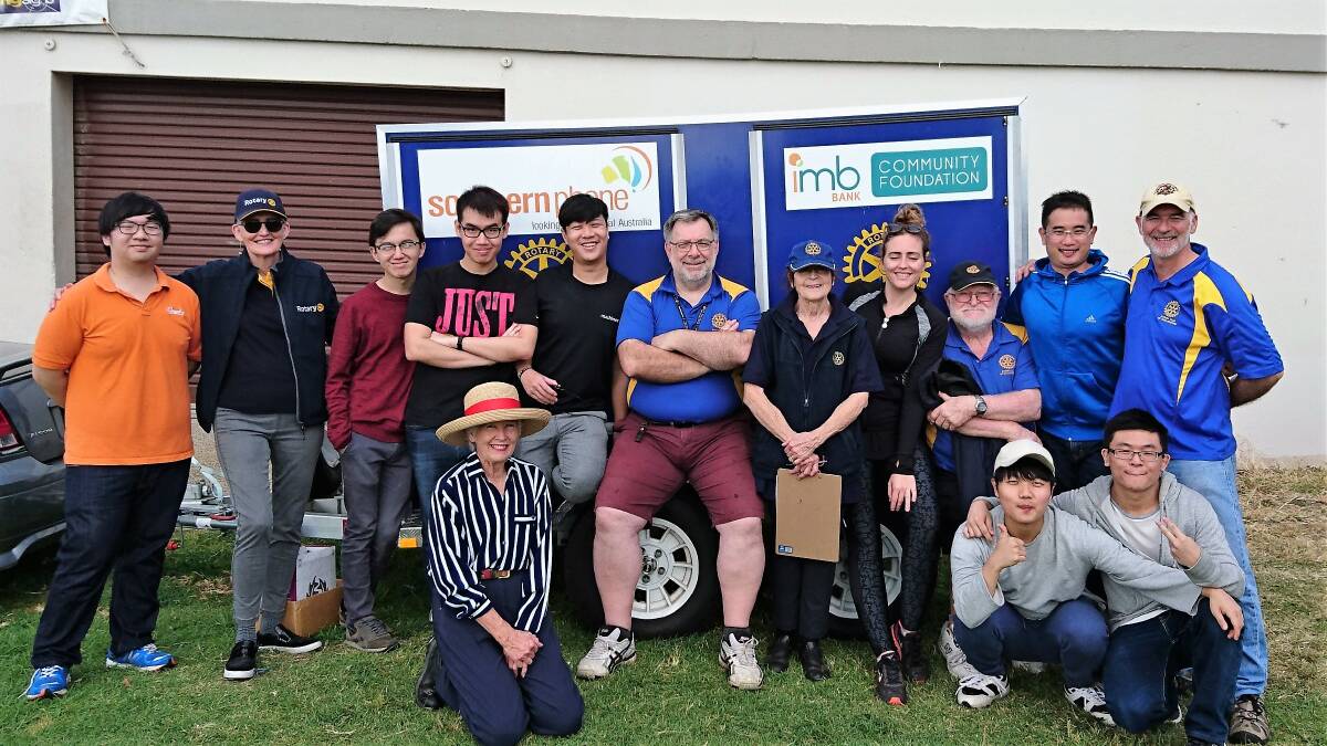 Charity support: Seven international students joined Rotary Club of Wollongong members and their families to help out at the Mother's Day fun run in support of breast cancer research.   