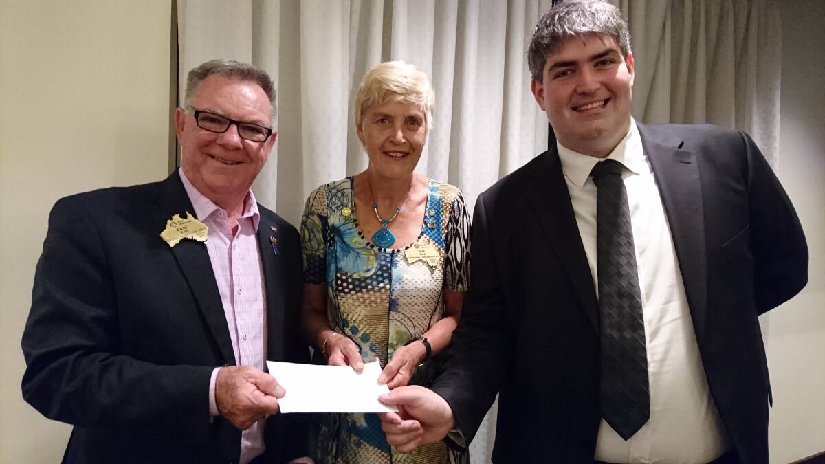 Polio battle: District Rotary Foundation chair Paul Reid receives cheques for more than $8200 from Assistant Governor Northern Illawarra Rotary Clubs Sue Clark and former president of UOW Rotoract Club Zac Fitzpatrick.