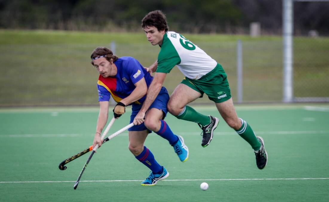 Rivals: Uni's Ryan Practor and Albion Park's Rhys Grey clash during a match earlier this season. The Park beat Uni 4-2 on Sunday. 