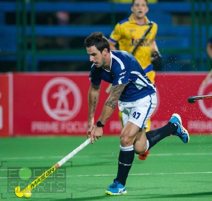 On top:  Kieran Govers playing for Dabang Mumbai against the Punjab Warriors in Mumbai during last weekend's Indian Hockey League round.