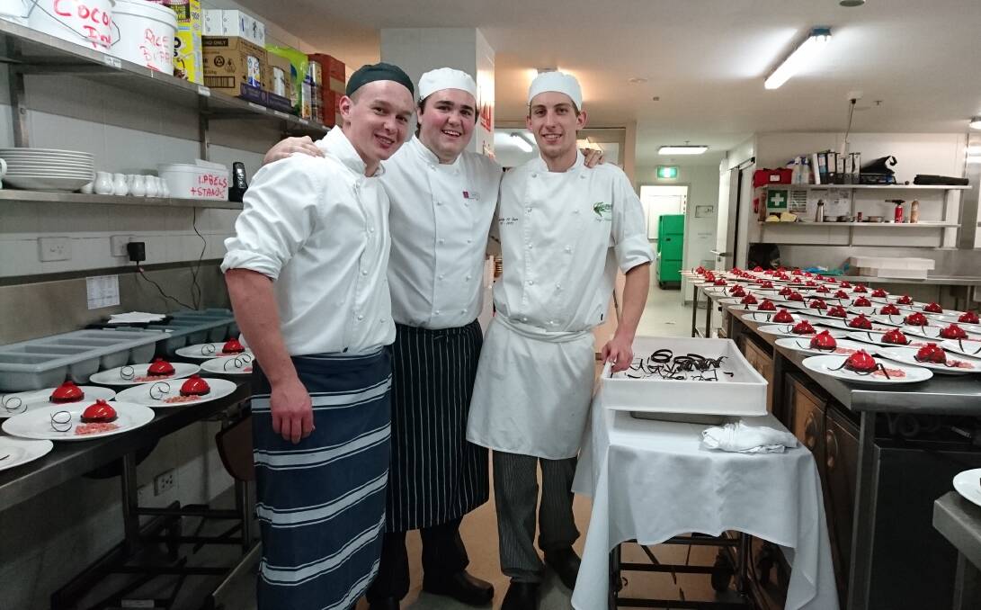 Talented trio: Crookwell butcher Hamish Gibbs, Wollongong chef Billy Cox and Mittagong pastry chef Troy Hindmarsh, surrounded by the very colourful desserts presented as part of the degustation at the Sage Hotel.