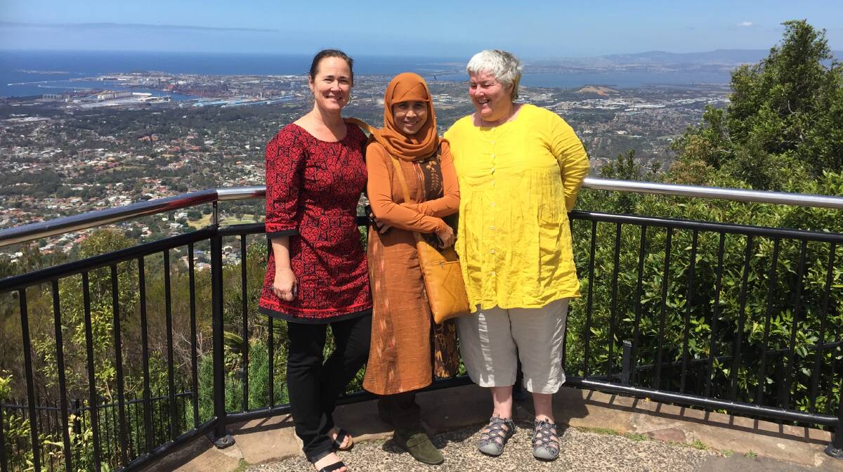 VISITING FEMINIST: Indigo Foundation pair Sally Stevenson and Libby House took their Indonesia visitor, PEKKA founder Nani Zulminarni (centre), to Mount Keira Lookout. Picture: Supplied