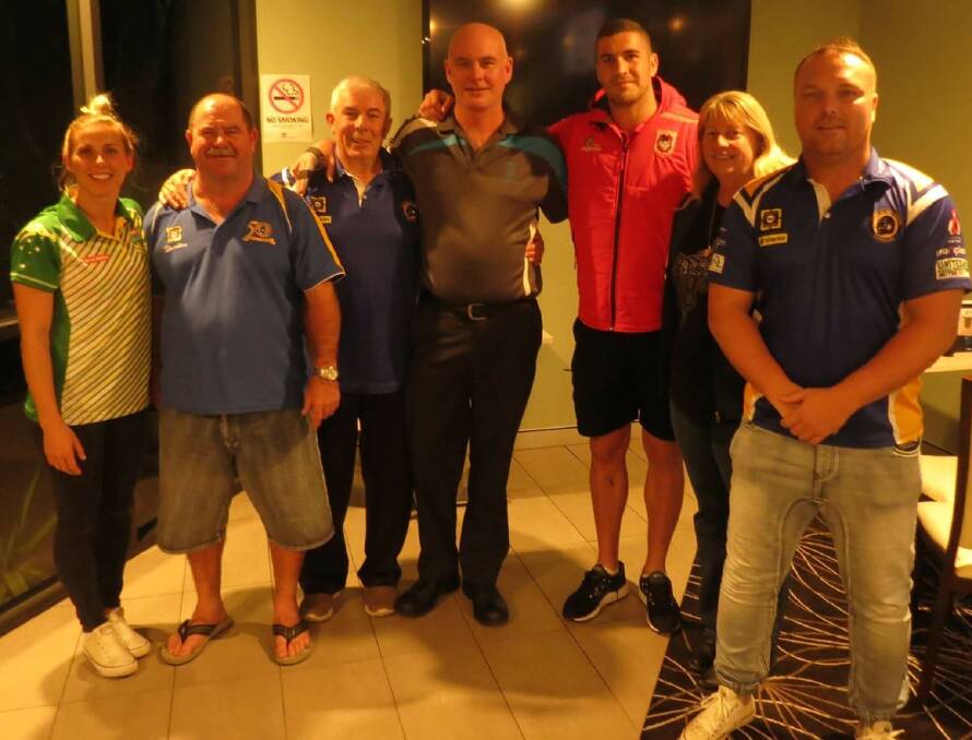 MAKING A CHANGE: Sam Bremner (Jillaroos) and Dragons player Joel Thompson (third from right) with Gorillas representatives Bruce Clark, Manuel Serrano, Steve Anderson, Sharon Clark and Don Kane. Picture: Supplied