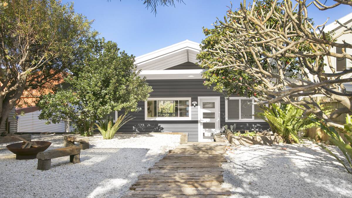 FOR SALE: A renovation has transformed this original miner's cottage into a designer beach house. See our website for more images of this property. 