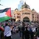 Protesters closed down Melbourne's Flinders Street intersection. (Joel Carrett/AAP PHOTOS)