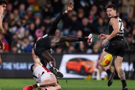 Port Adelaide's Aliir Aliir suffered concussion after being tackled by St Kilda's Jack Higgins. (Matt Turner/AAP PHOTOS)