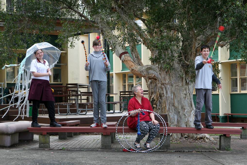 Students from Dapto High School’s autism support unit, Courtney Newbold (left), Jayden Gibson and Dylan Claydon (right) with teacher Fiona McKay get ready for their circus show. Picture: SYLVIA LIBER