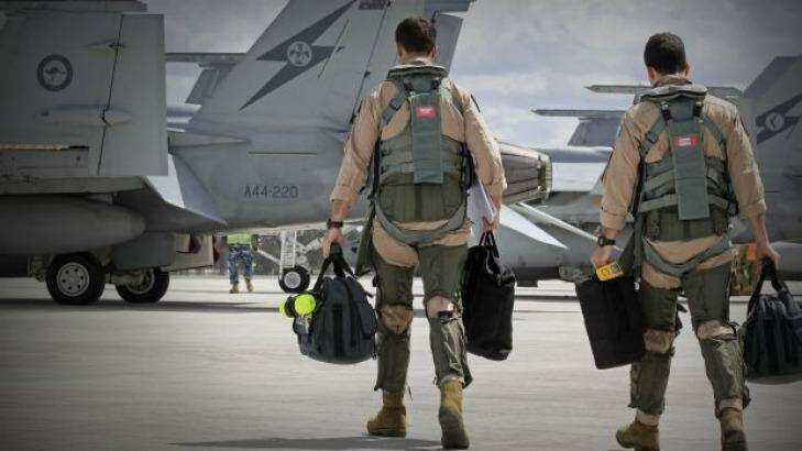 F/A-18F Super Hornet aircrew head to their aircraft in preparation for departure to the Middle East. Photo: Supplied
