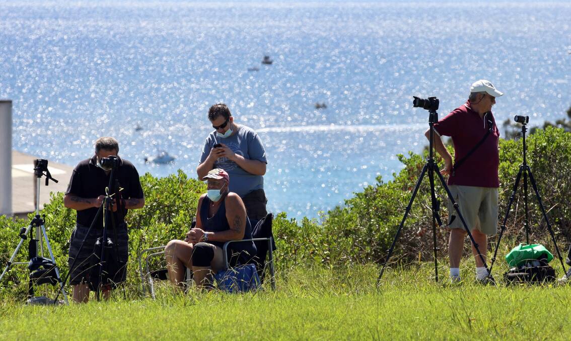 Onlookers and photographers waiting for the stack to drop at Gallipoli Park in Port Kembla. Picture: ORLANDO CHIODO