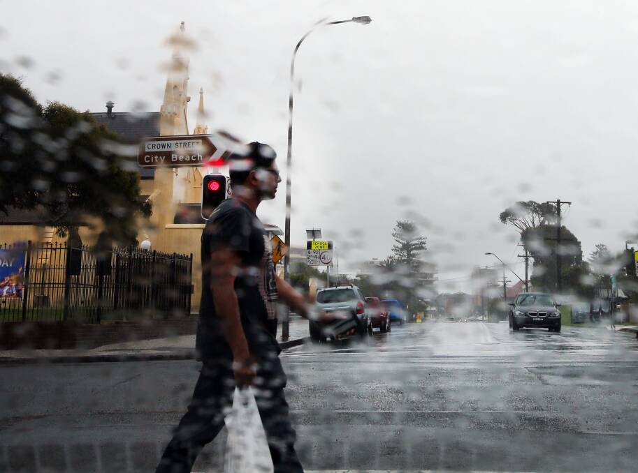 Police have issued a plea for drivers to slow down and for pedestrians to be more aware as inclement weather conditions set in across the Illawarra. Picture: Sylvia Liber 