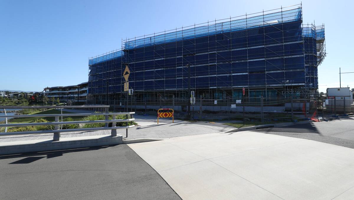 Work has resumed on the fitout of the Ancora apartment block in Shell Cove after the project was hit by delays late last year. Picture by Robert Peet