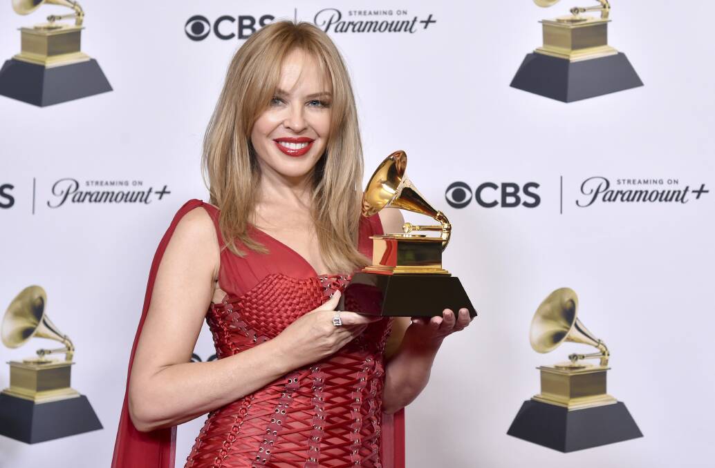 Kylie Minogue poses with her award for best pop dance recording for "Padam Padam" during the 66th annual Grammy Awards. Picture by Richard Shotwell/Invision/AP