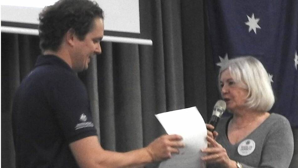Recognition: Marilyn Jarrett of Kiama Rotary presents Paralympian wheelchair basketballer Brett Stibners with a certificate of appreciation. Picture: Supplied