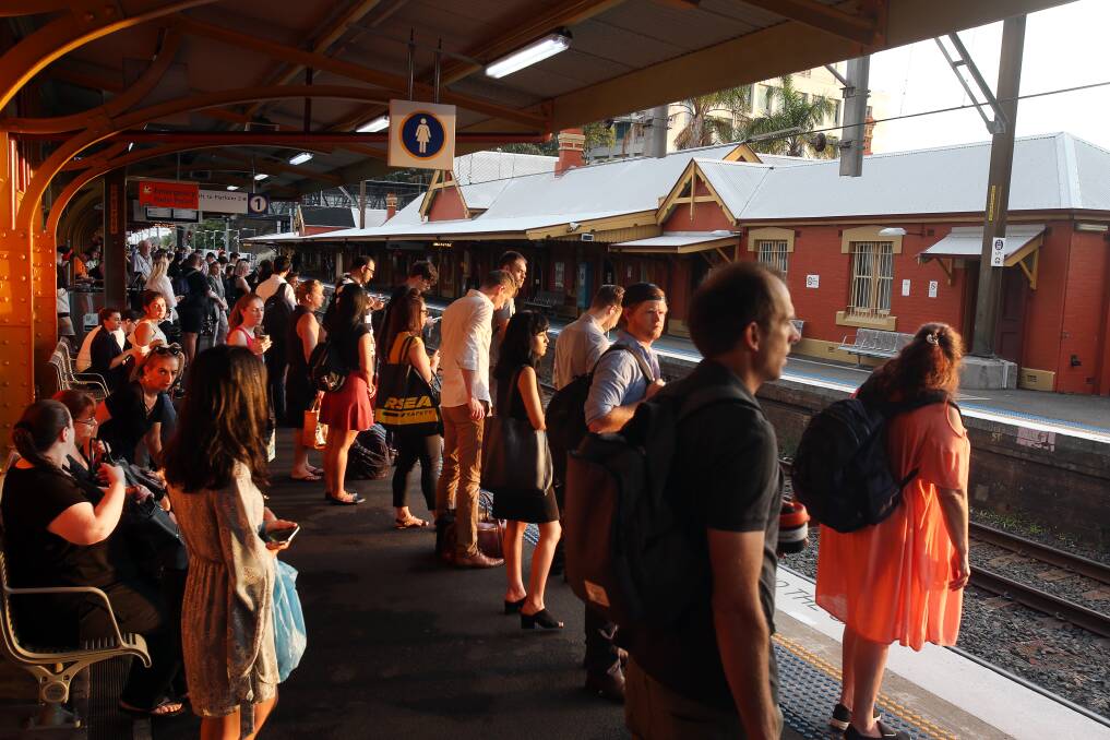 Commuters wait for a train at Wollongong station ... Ryan Park said Labor would put rail upgrades before the F6 extension if it wins the 2019 election. Picture: Robert Peet