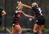 Danika Matos (left) celebrates with Wanderers teammate Sophie Harding after they scored a goal against Perth last month. Picture by Mark Kolbe/Getty Images