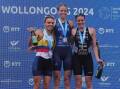 Saturday's elite women's race winner Tilda Mansson, of Sweden, (centre) celebrates on the podium with Colombia's Maria Carolina Velasquez and New Zealand's Ainsley Thorpe. Picture by Sylvia Liber