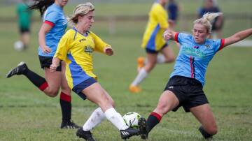 UOW's Lilliana Clark (left) and Shellharbour opponent Maggie Page battle for possession during a game last year. Picture by Adam McLean