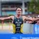 Australia's Luke Willian raises his arms in triumph as he prepares to win the elite men's race at Saturday's World Triathlon Cup in Wollongong. Picture by Sylvia Liber