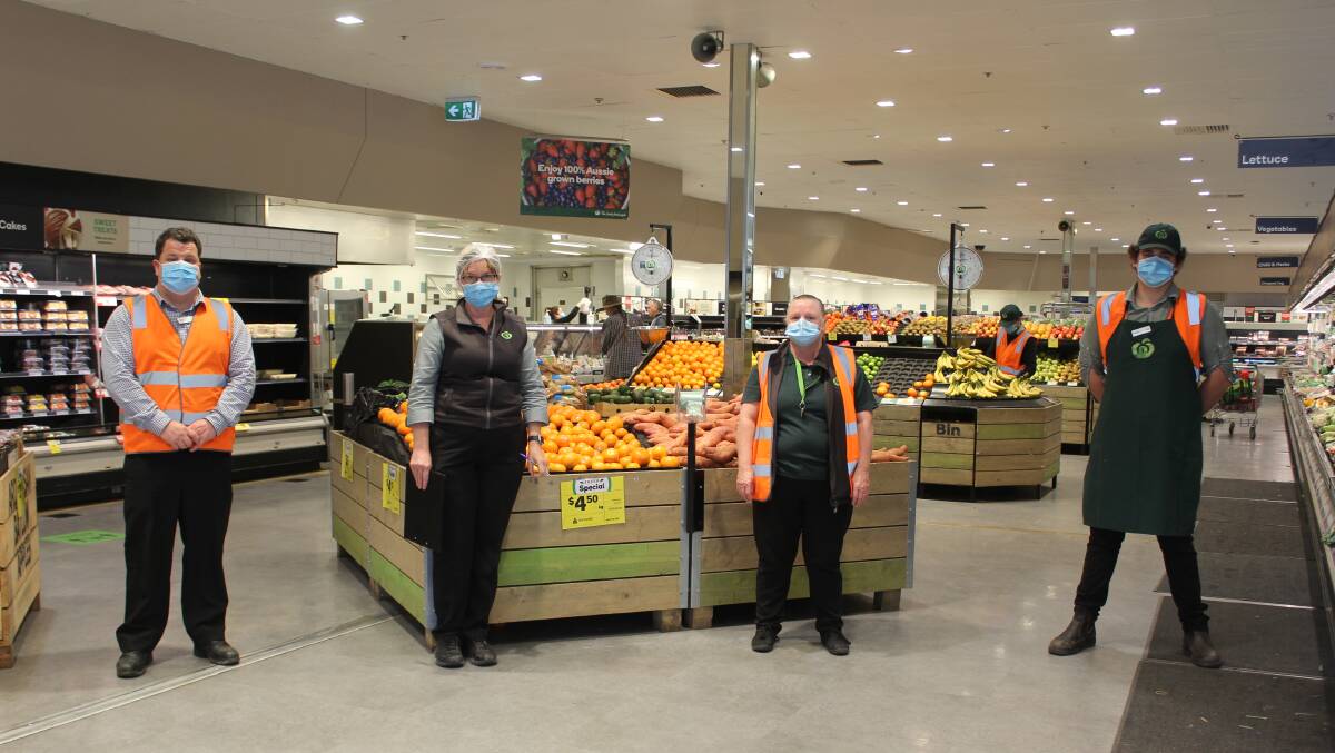 DOING THEIR BIT: Woolworths Moree store manager Troy Crocker and staff members Flo Botfield, Heather Moore and David Jackson are among the local team wearing masks in store.