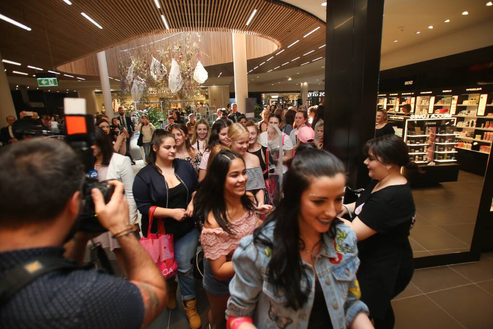 Join the Queue: Shoppers rushed into Wollongong last week for the grand opening. 