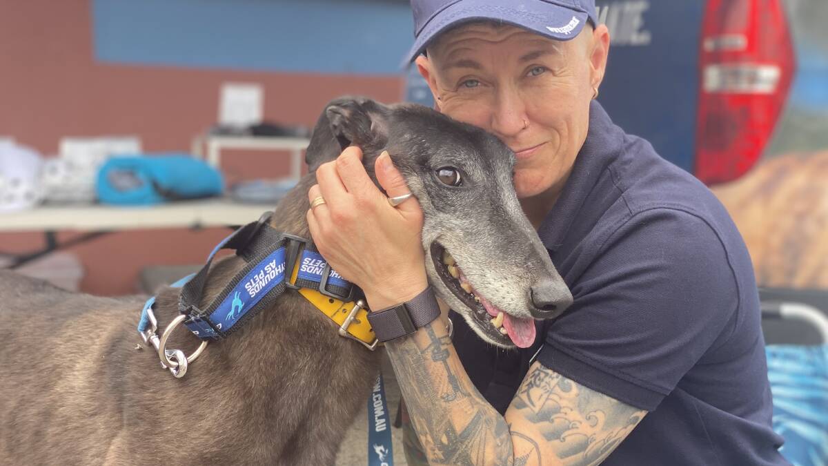 Rehoming and adoption programs director for Greyhounds NSW Jamie Palmer and Ashy at Bulli on Sunday.