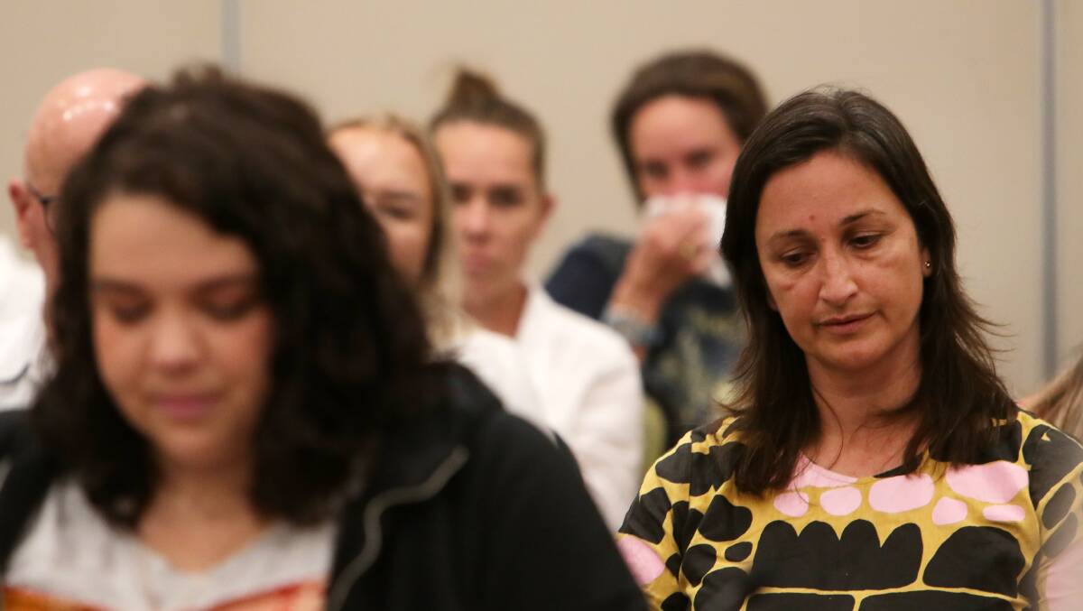 Ms Settecasse, left, listens to testimony at Wollongong's birth inquiry hearing last September. Picture by Sylvia Liber