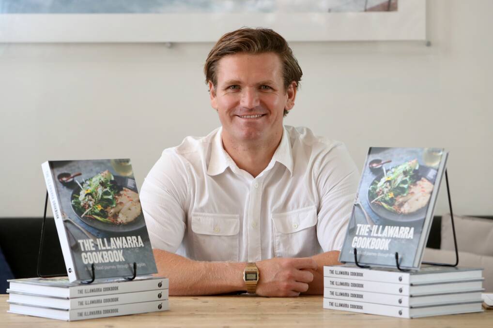 PROUD: Stefan Posthuma-Grbic with Quicksand's latest book, celebrating food from Dapto to Darkes Forest and beyond. Picture: Adam McLean