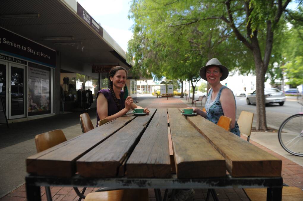COFFEE BREAK: Mirinda Thorpe and Annie Hobby take advantage of outdoor dining in Roberts Ave, Horsham. Picture: ALEXANDER DARLING