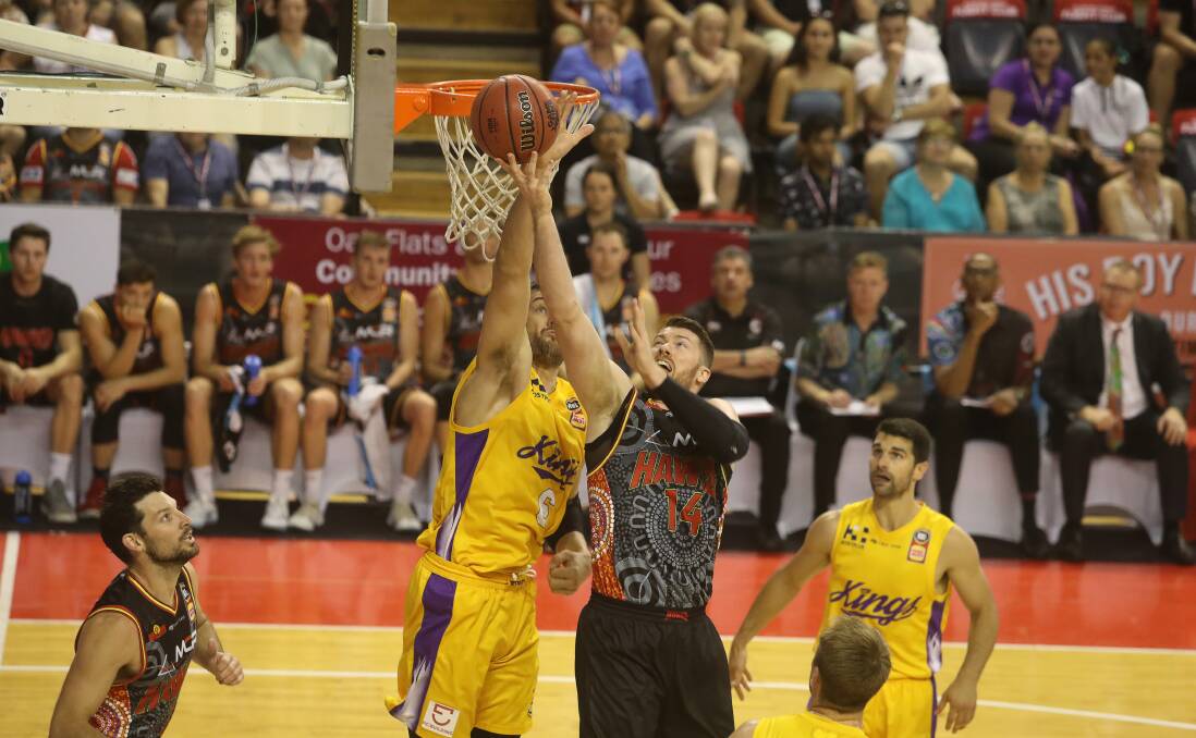 BIG BOYS: Andrew Bogut and Brian Conklin go at it inside in Sunday's Hawks-Kings clash at the WEC. Picture: Robert Peet. 