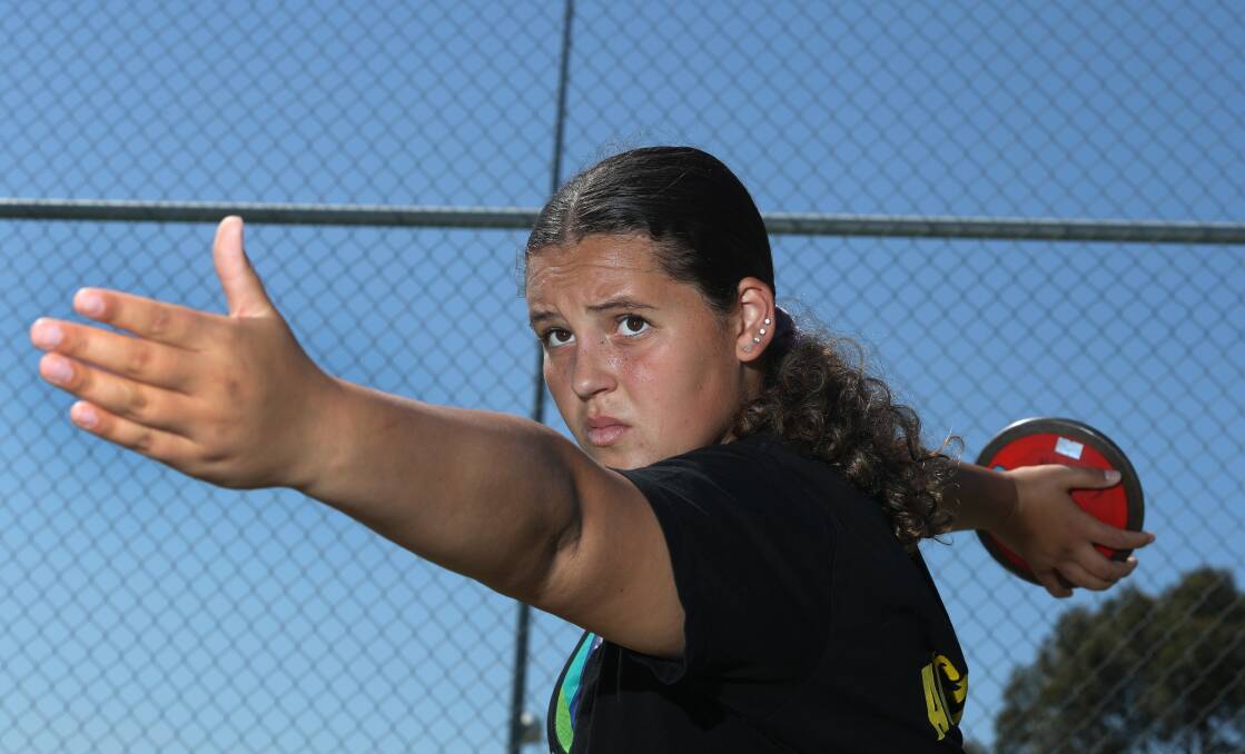 DETERMINED: Shellharbour teenager Rosie Boyland steadies and prepares to launch her next discus throw. Picture: Robert Peet