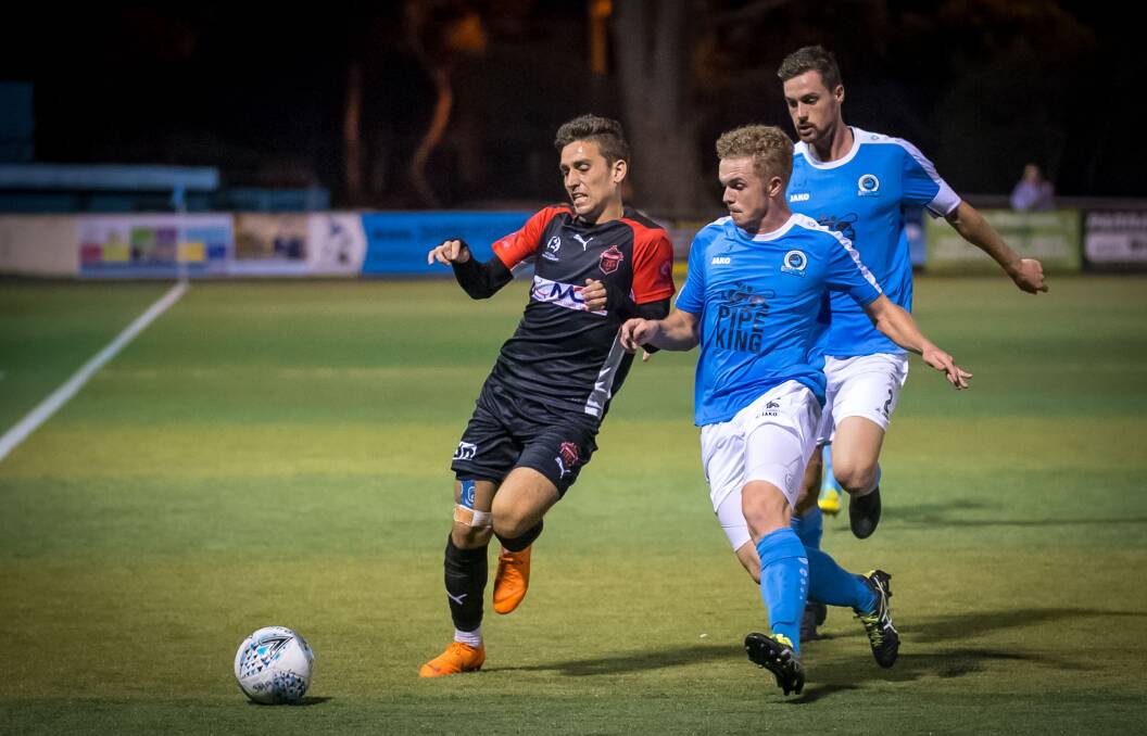 TOUGH NIGHT: Wolves attacker Josh MacDonald heads down the line in the club's loss to Sutherland Sharks. Picture: FOOTBALL NSW/GEORGE LOUPIS