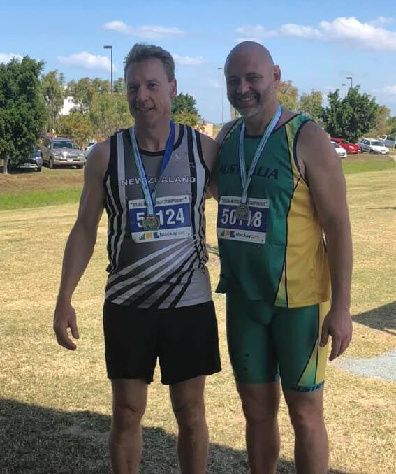 Silver success: Anthony Howlett (right) at the Oceania Masters with winner Rod Plimmer. 