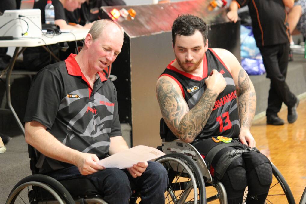 Discussion point: Wollongong coach Brendan Dowler and star player Luke Pople talk tactics on Sunday. Picture: Geoff Adams