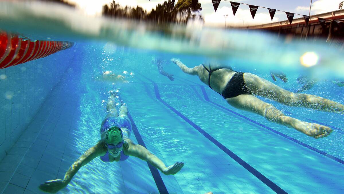 IN THE SWIM: Swimmers taking part in a previous MS 24 hour relay Mega Swim in Wollongong. This year's event is on March 14-15. Picture: Sylvia Liber
