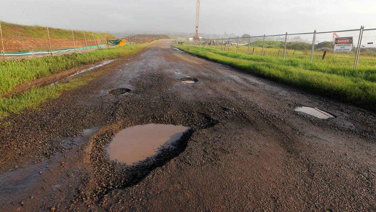 Potholes like this one on Boollwarroo Parade at Shellharbour have opened up because of the wet weather. Wollongong and Shellharbour council crews are working to fix them as soon as possible. Picture: Sylvia Liber