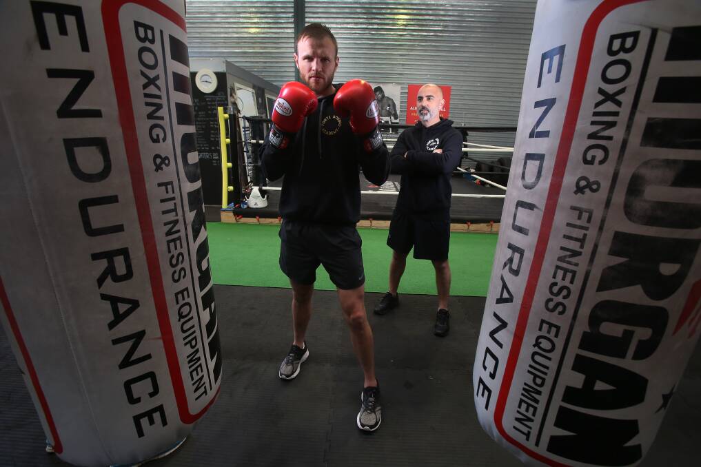 BREAK: Illawarra boxer Mark Lucas and his coach Nudge Mieli will wait five months before fighting again. Picture: Robert Peet