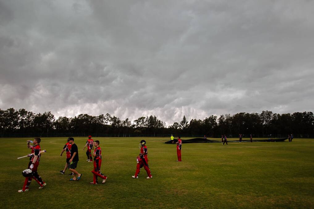 Wet, wet, wet: The covers come on at Oakleigh Park in the Twenty20 match between The Rail and Kookas on Saturday. Picture: Adam McLean
