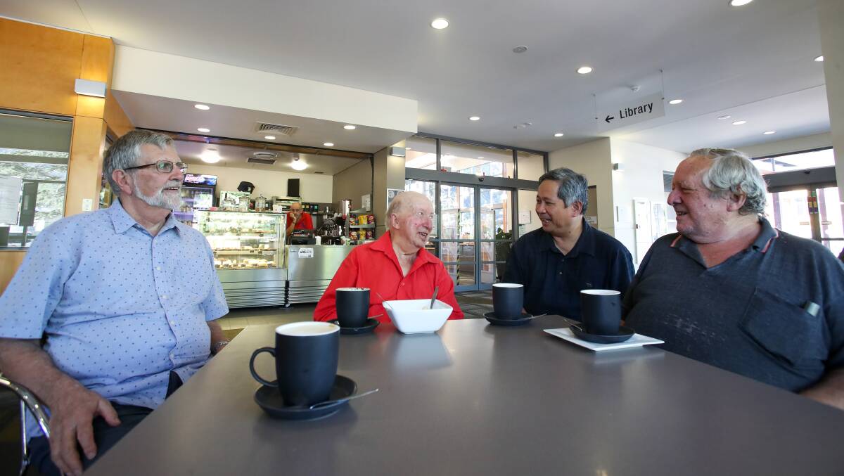 GET TOGETHER: ​Martin Bragger, Alan Schultz, Michael Lavilles and John Schultz having coffee at Cafe Mia in the Thirroul Community Centre. Martin and Michael have established the Not Alone group to reach out and help those feeling lonely and isolated. Picture: Adam McLean